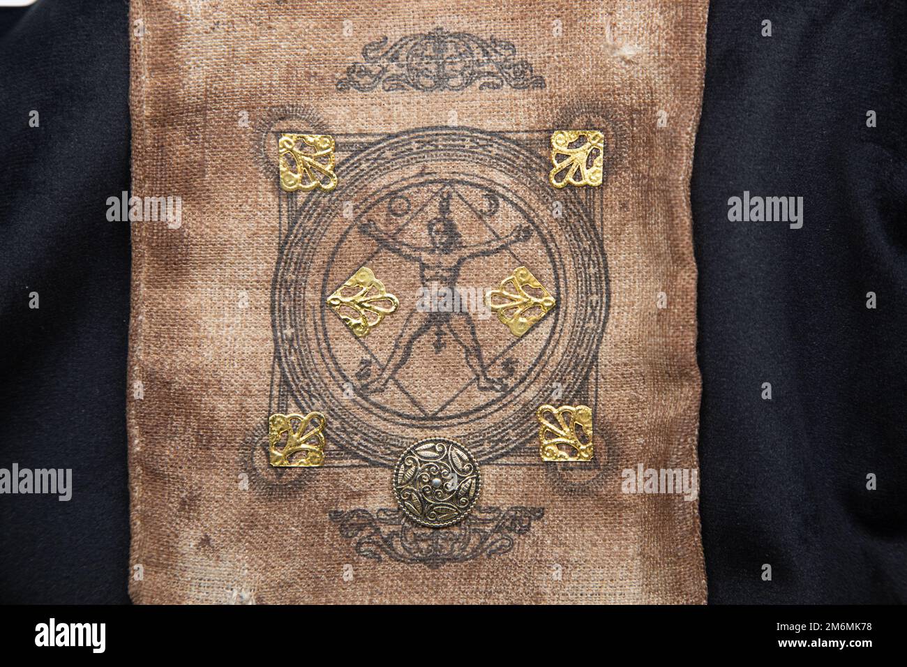 Ancient esoteric witchcraft background. Occultims and paganism old symbol, with mysterious runes alphabet Stock Photo