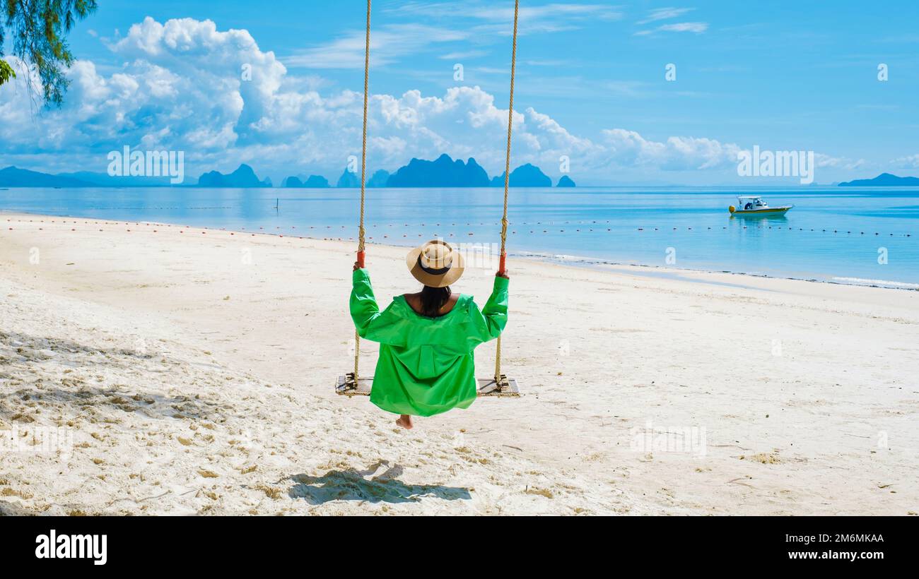 Woman beach swing swinging hi-res stock photography and images - Alamy
