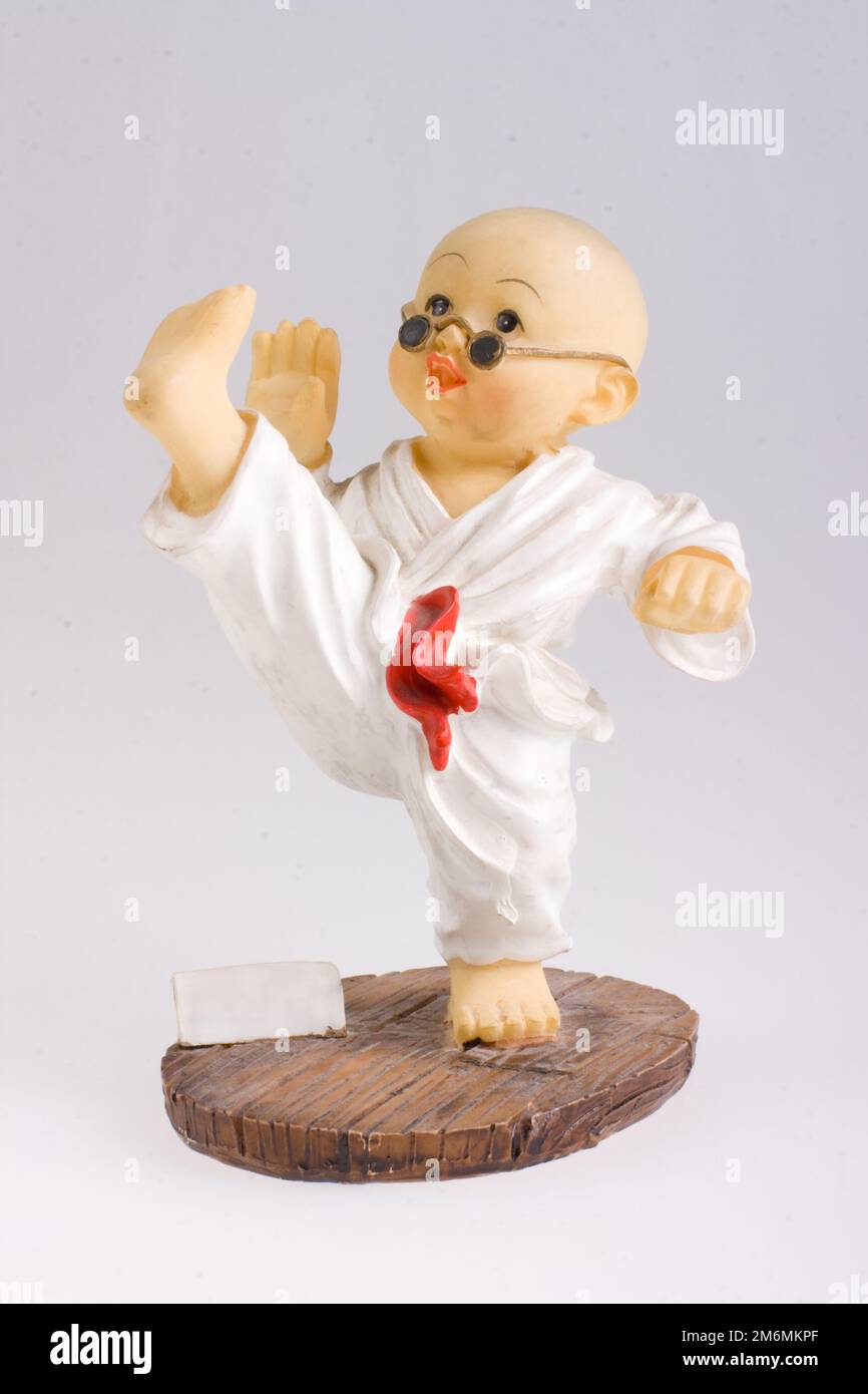 Porcelain figurine of the master of kung fu, shaolin, karate. Stock Photo