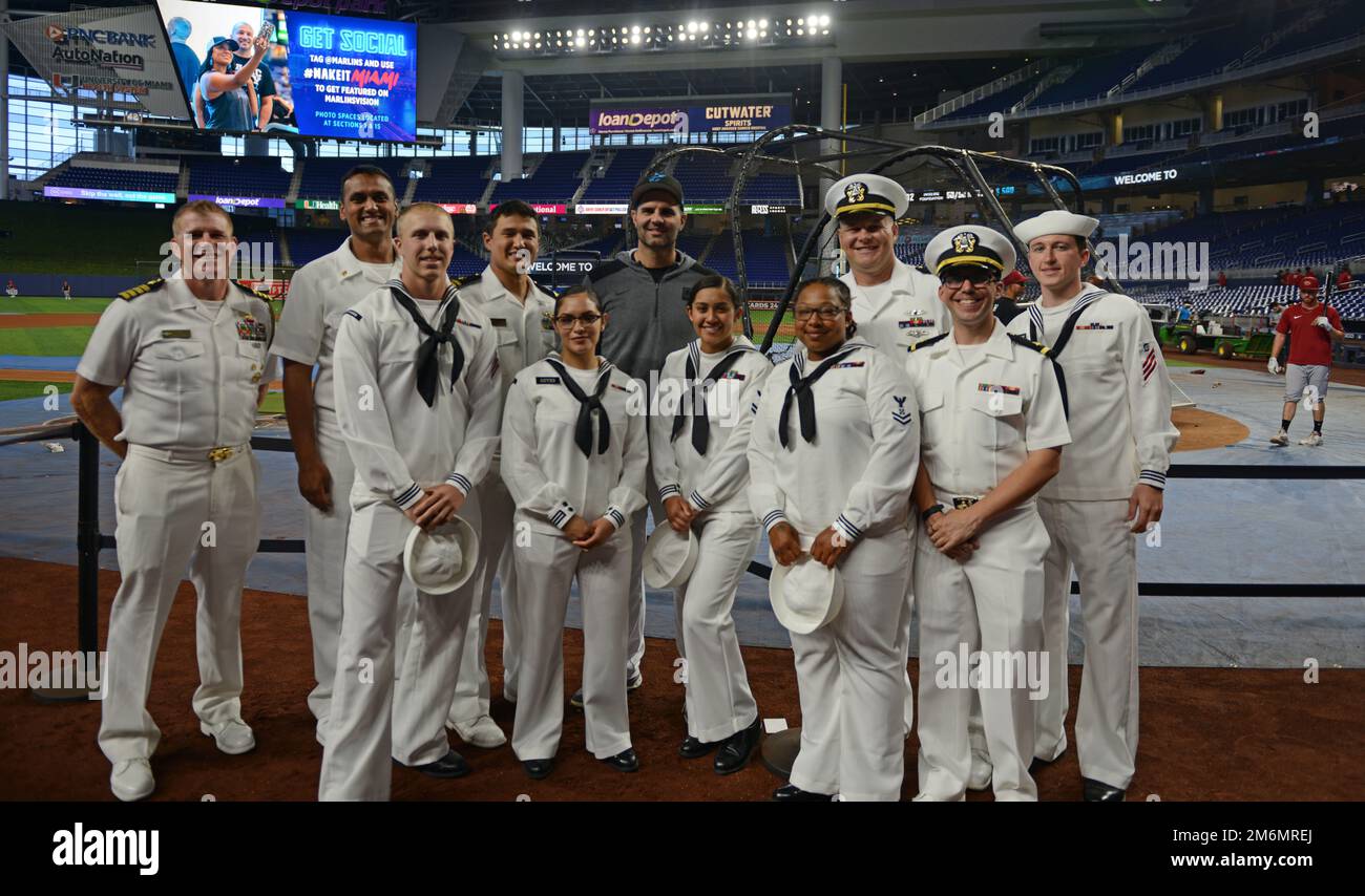 MIAMI, Fla. (May 2, 2022) - U.S. Navy Sailors take part in the pre-game festivities at a Miami Marlins Major League Baseball game during Fleet Week Port Everglades festivities, May. 2, 2022.  Fleet Weeks are designed to show Americans the investment they have made in their Navy and increase the awareness of the Navy’s role and purpose in our national defense. Stock Photo
