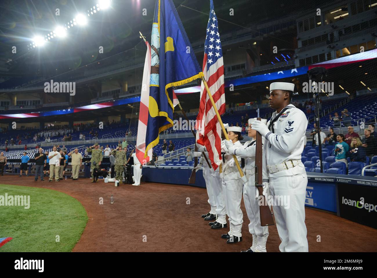MIAMI, Fla. (May 2, 2022) - U.S. Navy Sailors parade the colors at a Miami  Marlins Major League Baseball game during Fleet Week Port Everglades  festivities, May. 2, 2022. Fleet Weeks are