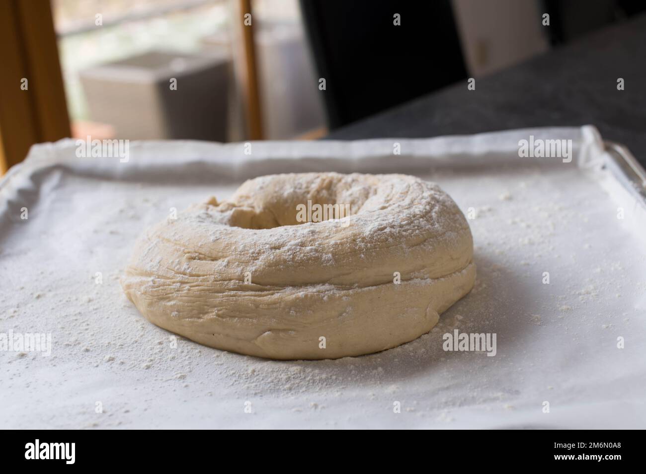 Raw ciabatta bread on a baking tray. Ready to bake Stock Photo