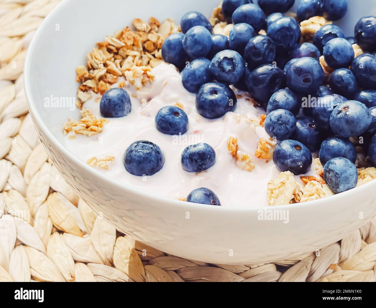 Blueberry yogurt cereal bowl as healthy breakfast and morning meal