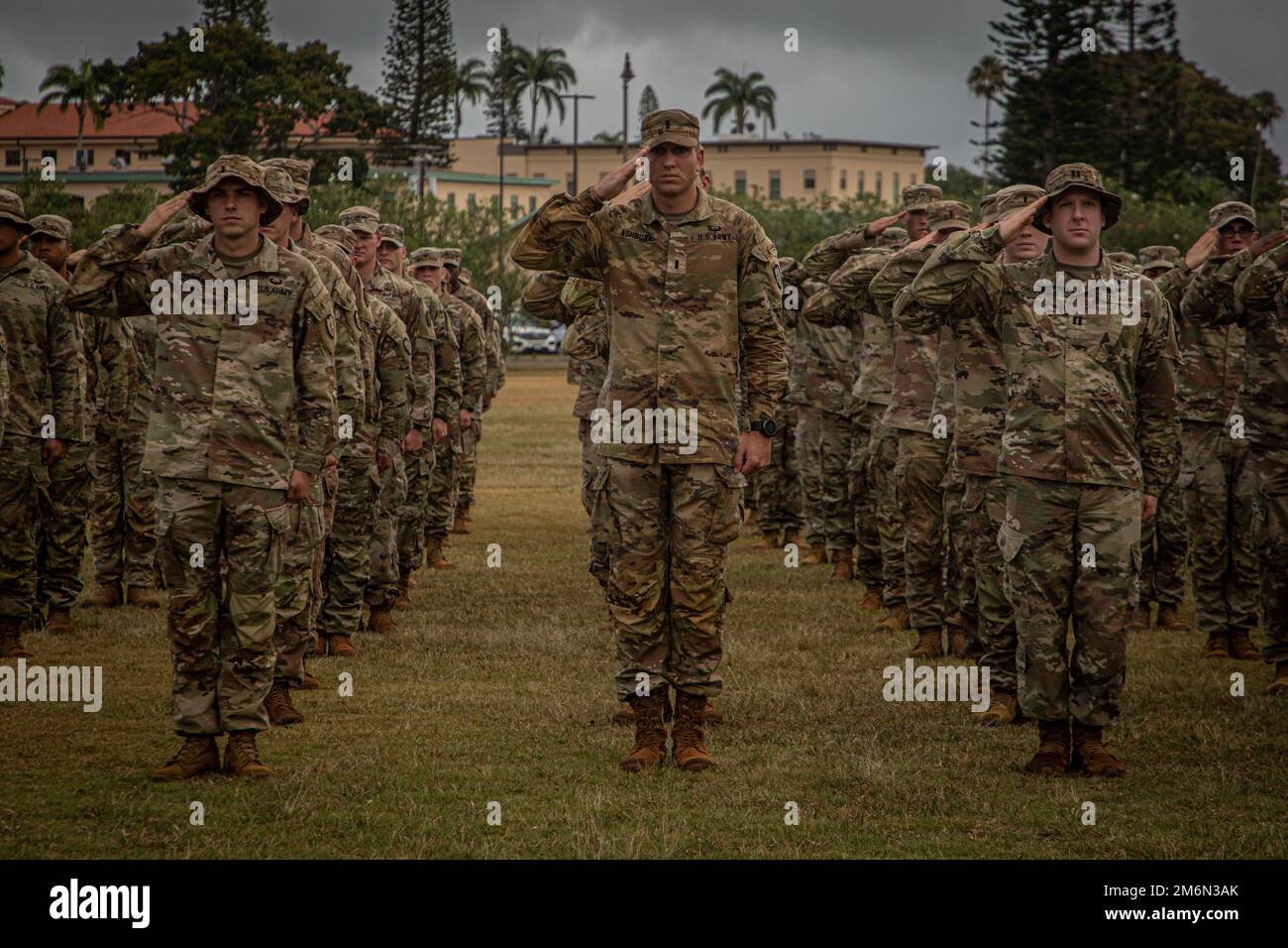 Soldiers from 25th Infantry Division salute during the closing ceremony