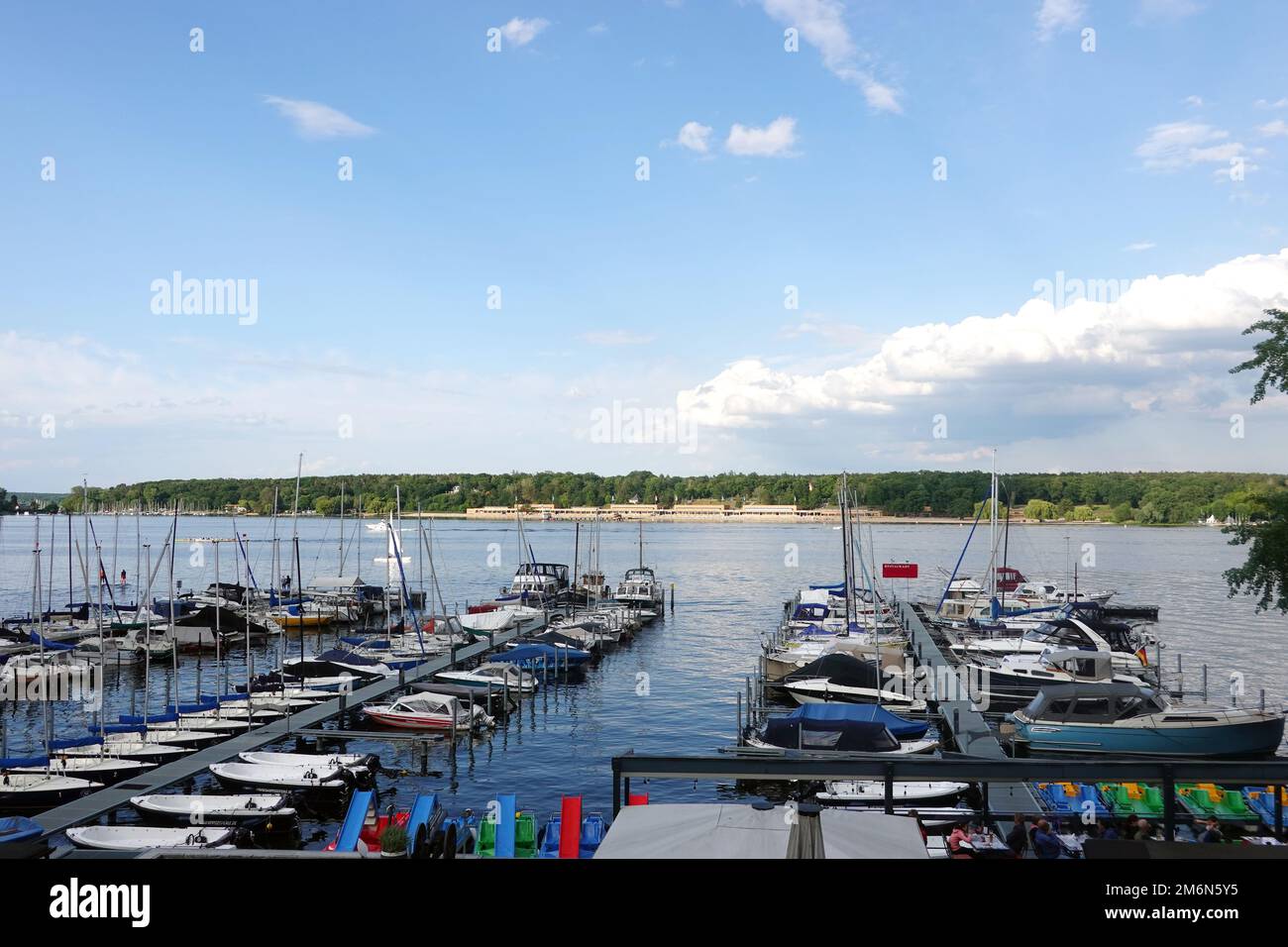 View over jetties across the Grossen Wannsee to the lido Stock Photo