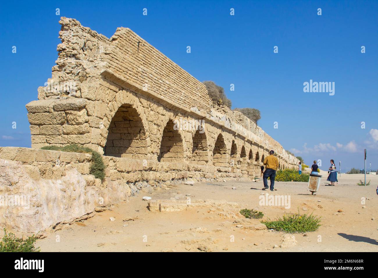 2 Nov 2022 A section of the magnificent ancient Roman aquaduct, where it crosses the Mediterranean beach at Ceaserea Maritima in Israel Stock Photo