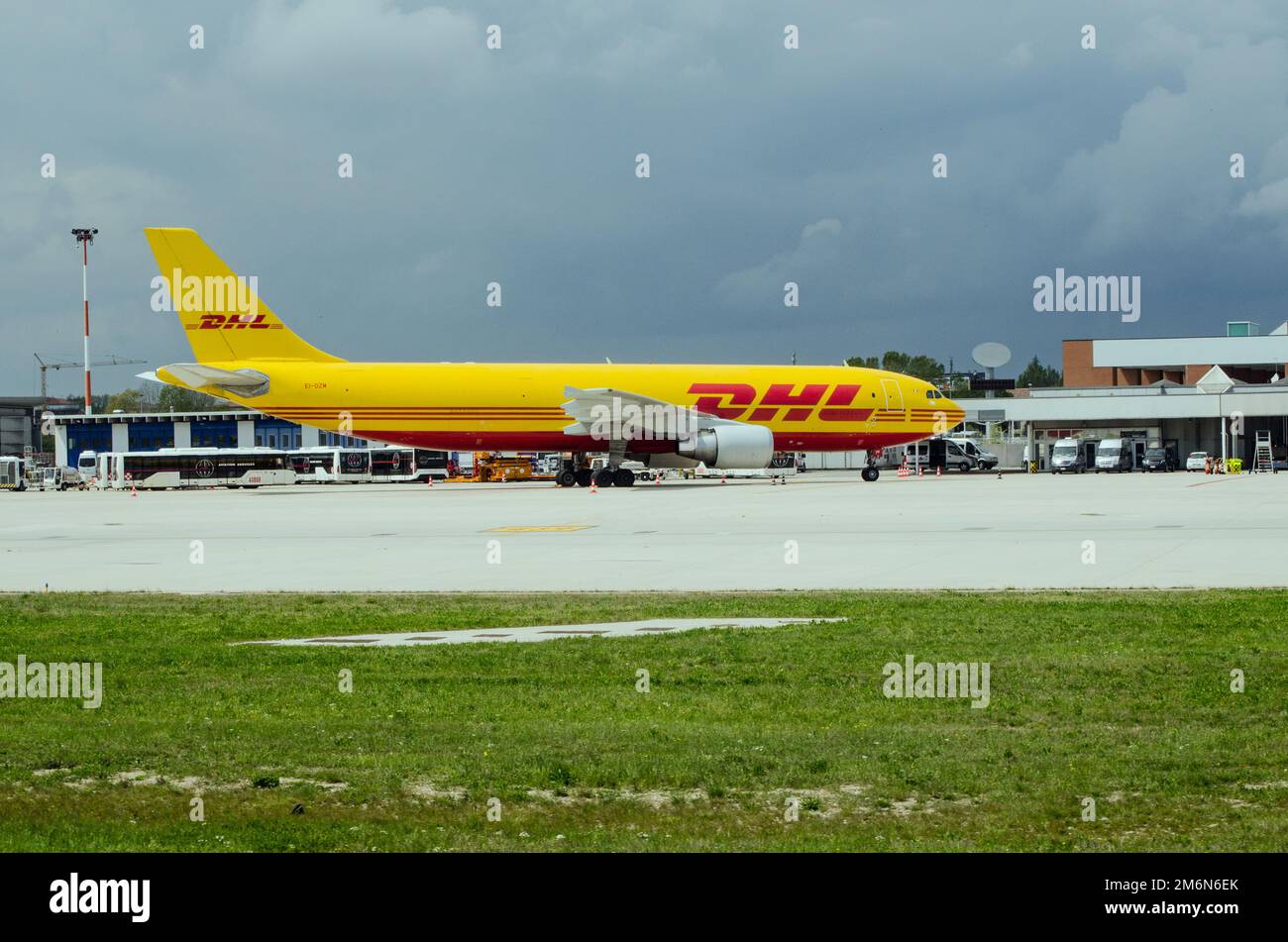 Venice, Italy - April 19, 2022: A DHL Airbus A300 cargo plane at Marco Polo Airport on a cloudy morning in Venice. Stock Photo
