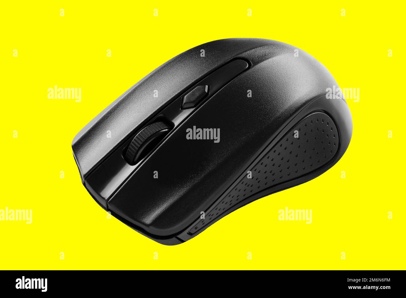 Gray modern computer wireless mouse. Isolated on yellow background. Stock Photo