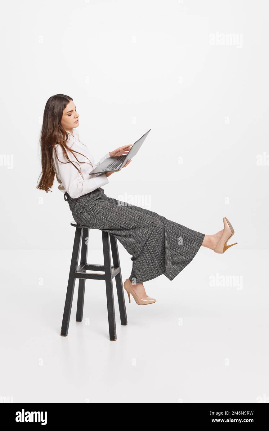 Female sitting in a vintage chair hi-res stock photography and images ...