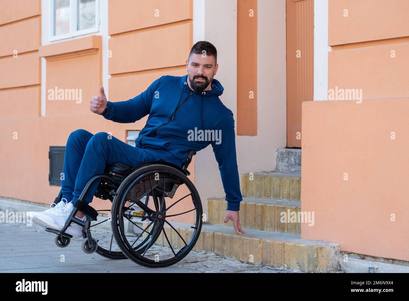 Man in a wheelchair hi-res stock photography and images - Alamy