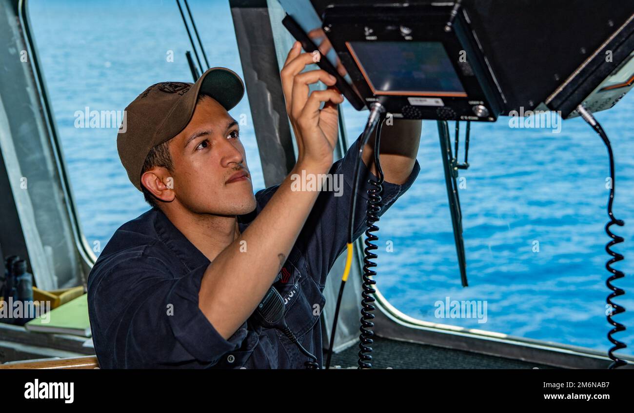 220501-N-JX182-1027 SOUTH CHINA SEA (May 1, 2022) Information Systems Technician 1st Class Carli Sarmiento, from Hemet, California, performs maintenance on communication equipment aboard the Independence-variant littoral combat ship USS Jackson (LCS 6). Jackson, part of Destroyer Squadron (DESRON) 7, is on a rotational deployment, operating in the U.S. 7th Fleet area of operations to enhance interoperability with partners and serve as a ready-response force in support of a free and open Indo-Pacific region. Stock Photo