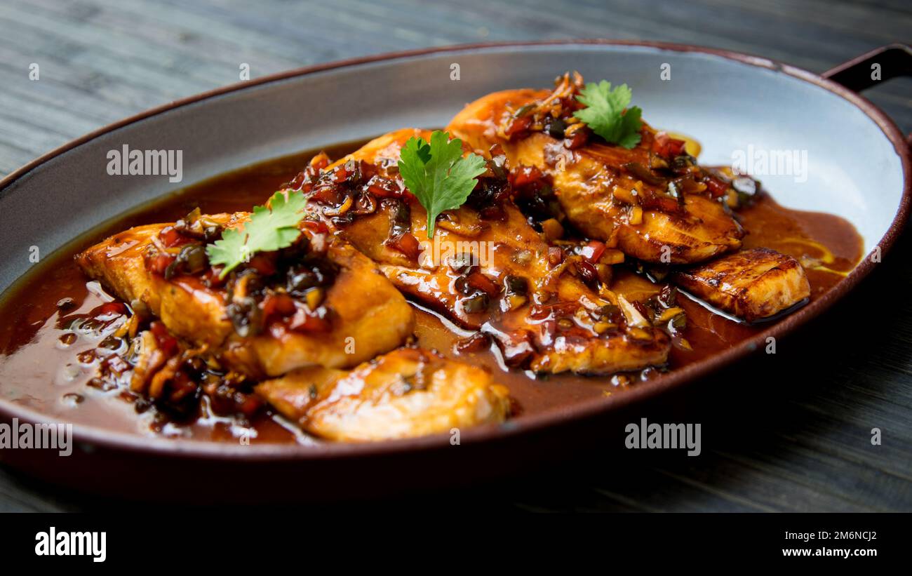 Baked salmon served with teriyaki sauce. Japanese Recipe Stock Photo