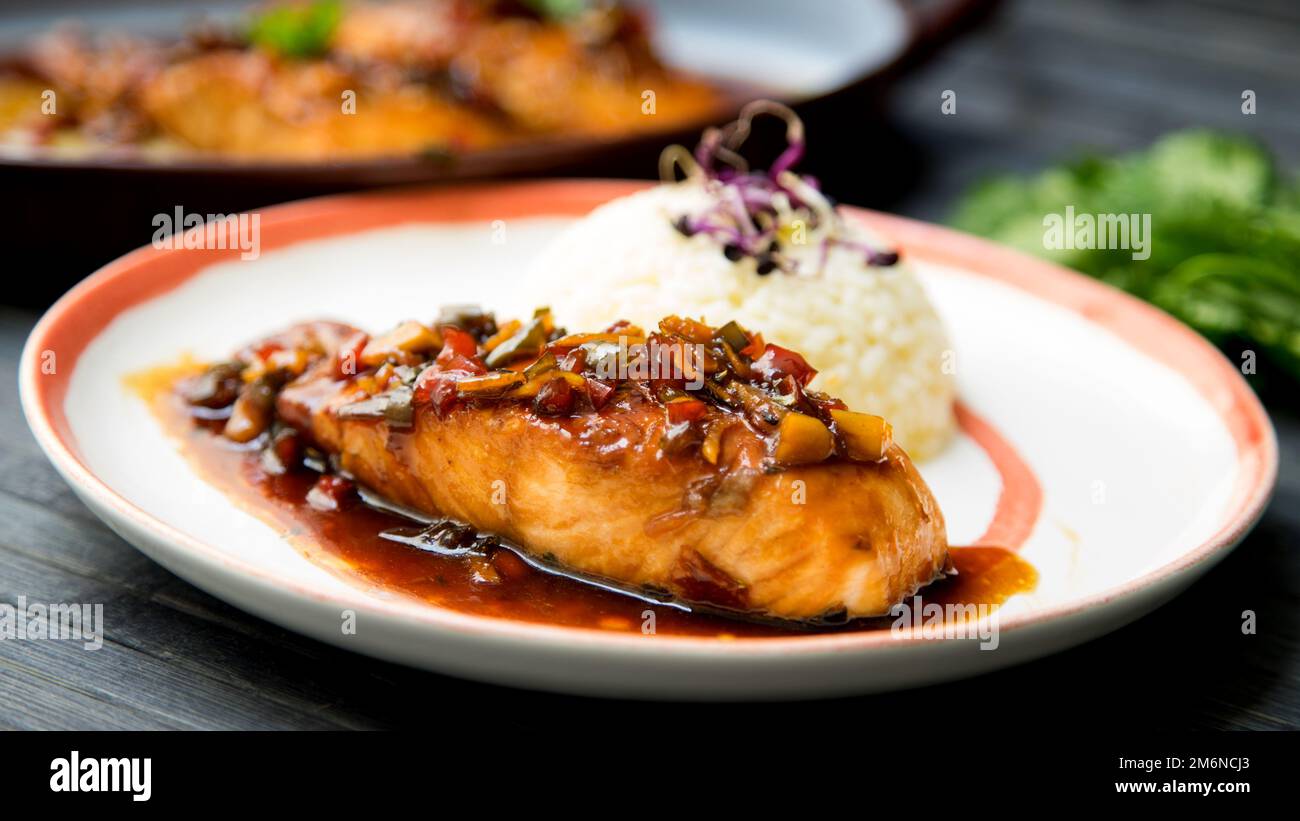 Baked salmon served with teriyaki sauce. Japanese Recipe Stock Photo