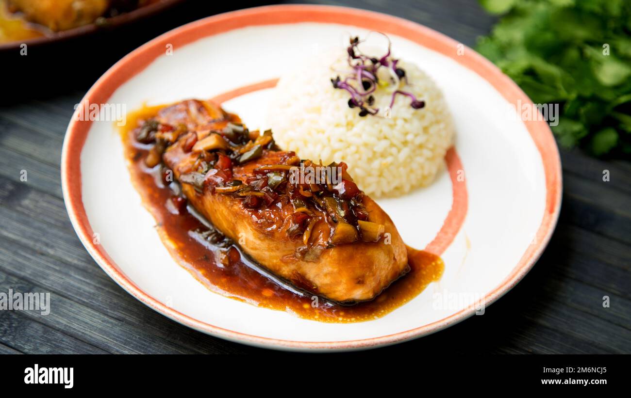 Baked salmon served with teriyaki sauce. Japanese Recipe Stock Photo