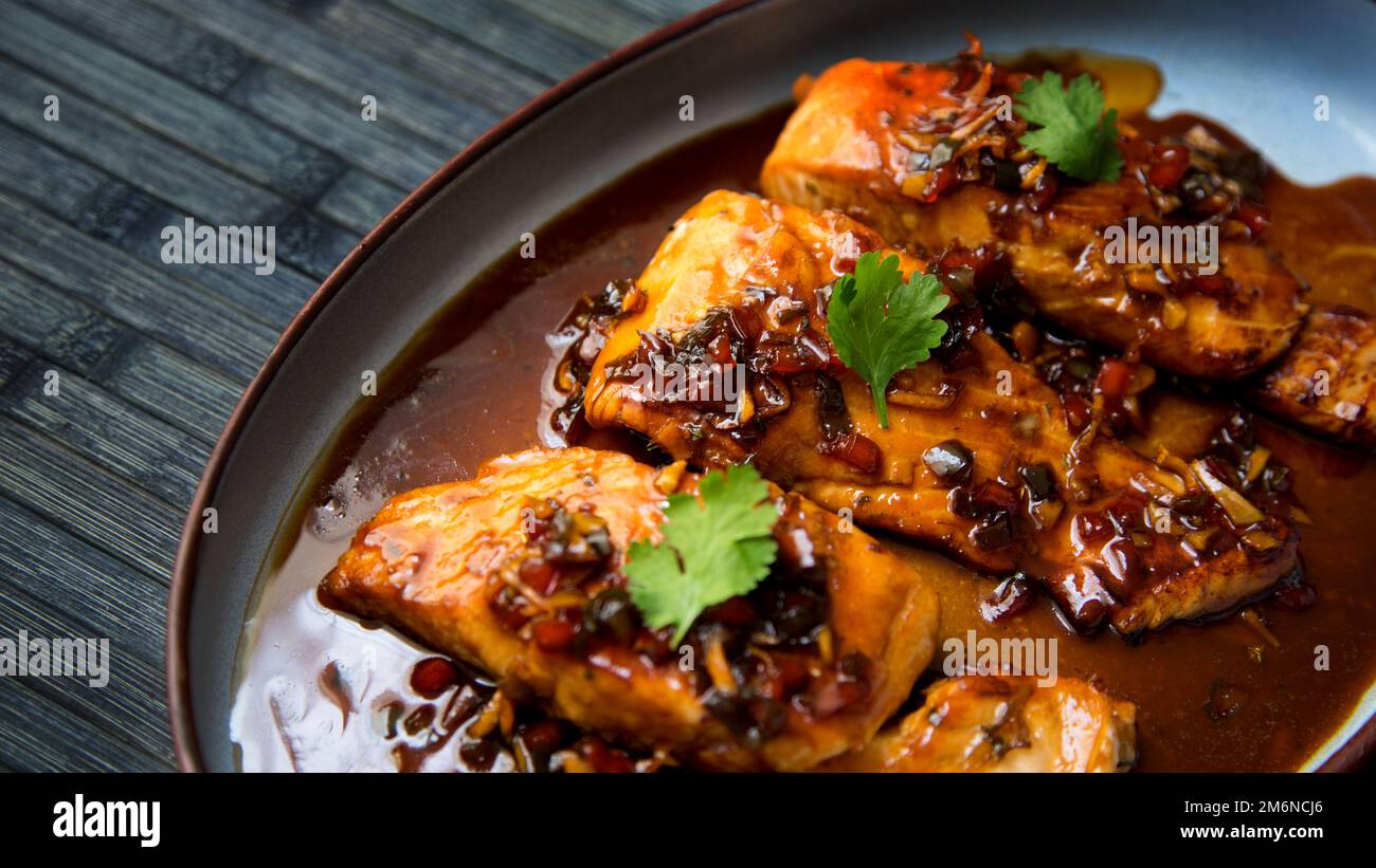 Baked salmon served with teriyaki sauce. Japanese Recipe Stock Photo