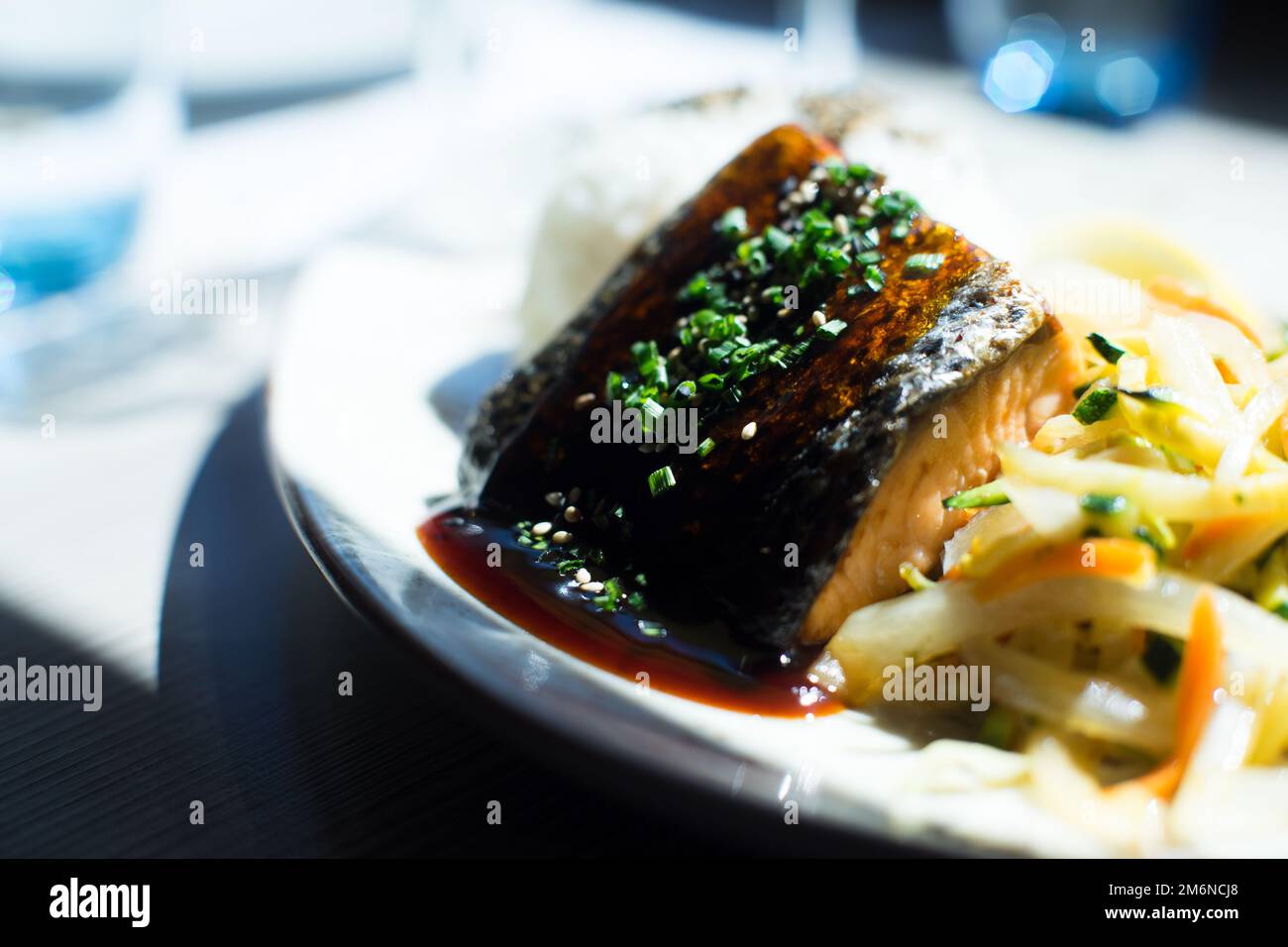 Baked salmon served with teriyaki sauce. Japanese Recipe Stock Photo