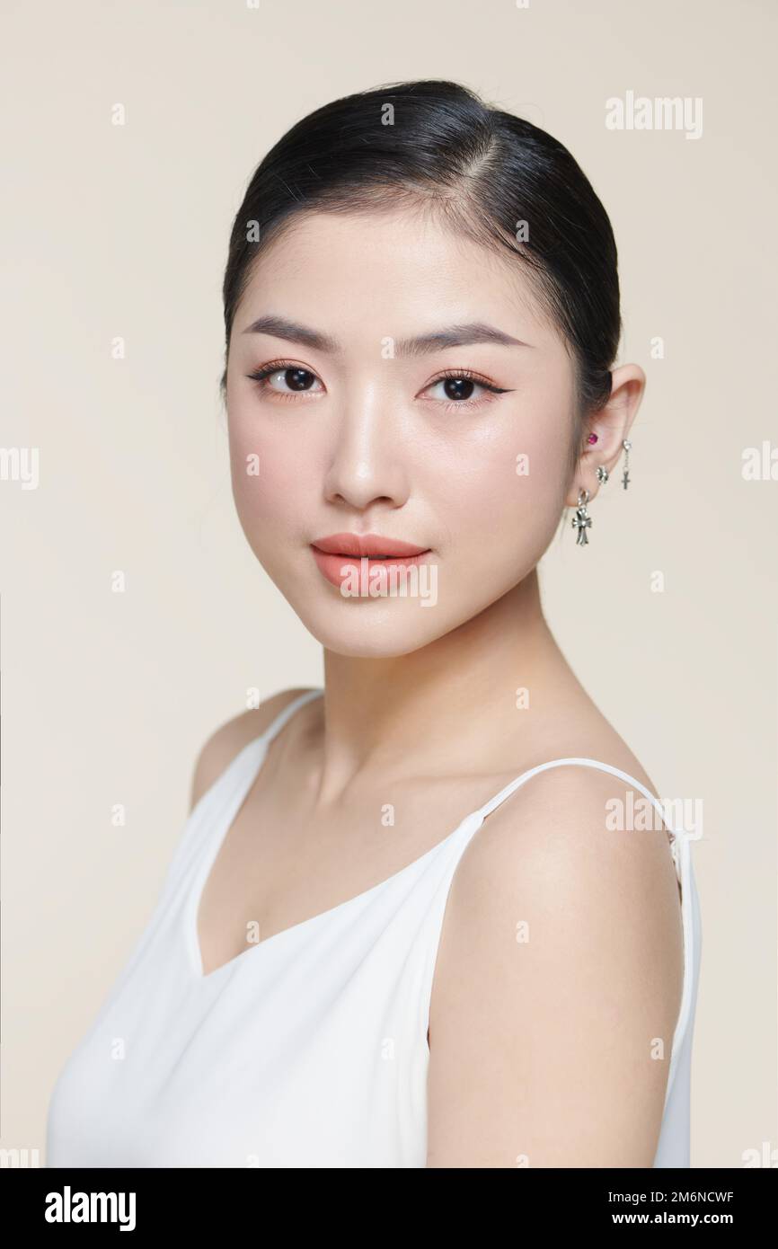 Asian woman with a beautiful face and fresh, smooth skin. Stock Photo