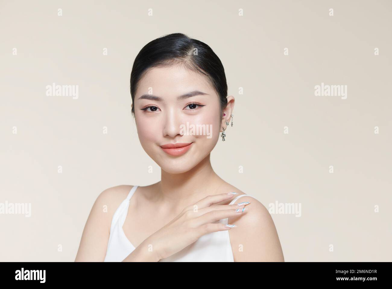 Beautiful young asian woman with clean fresh skin on white background, Stock Photo
