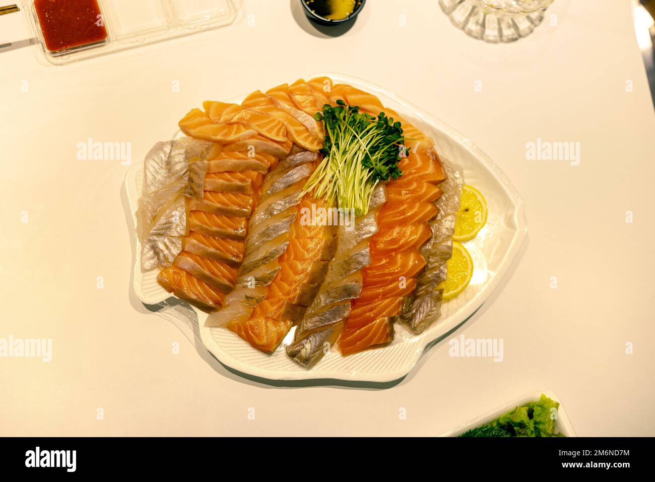 Salmon and raw fishes on the plate Stock Photo