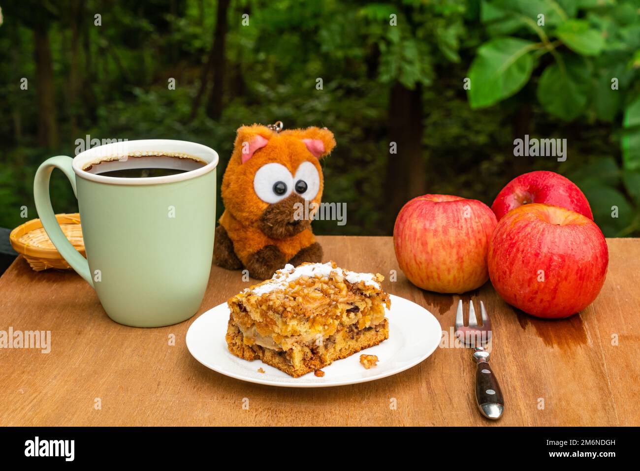 Coffee time with a portion of delicious homemade fruit cake in white