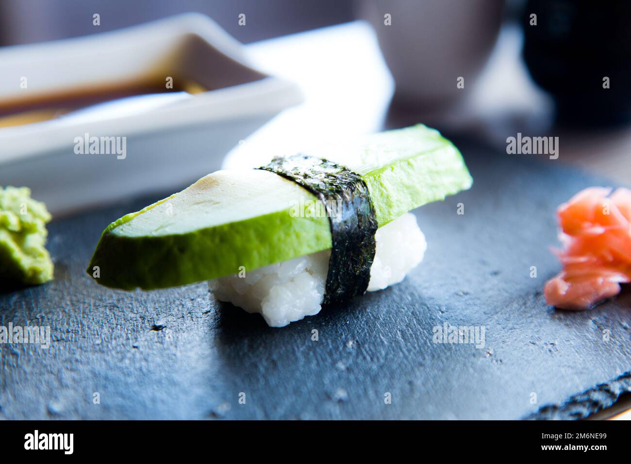 Vegan Nigiri Sushi with green avocado. Vegetarian Japanese Food. Stock Photo