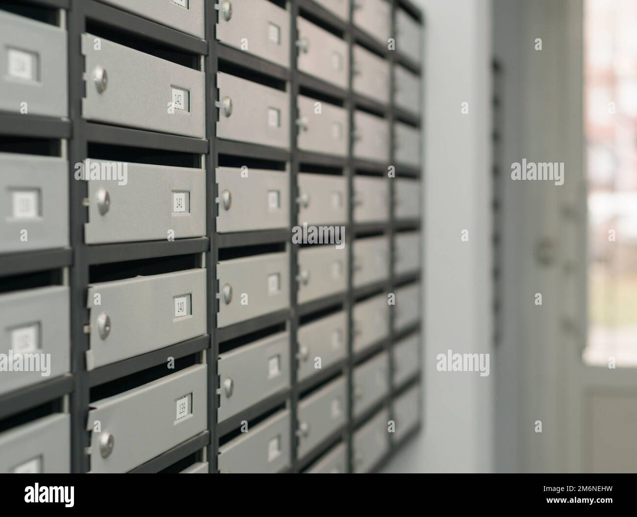 Mailboxes filled with numbers. In an apartment building Stock Photo Alamy