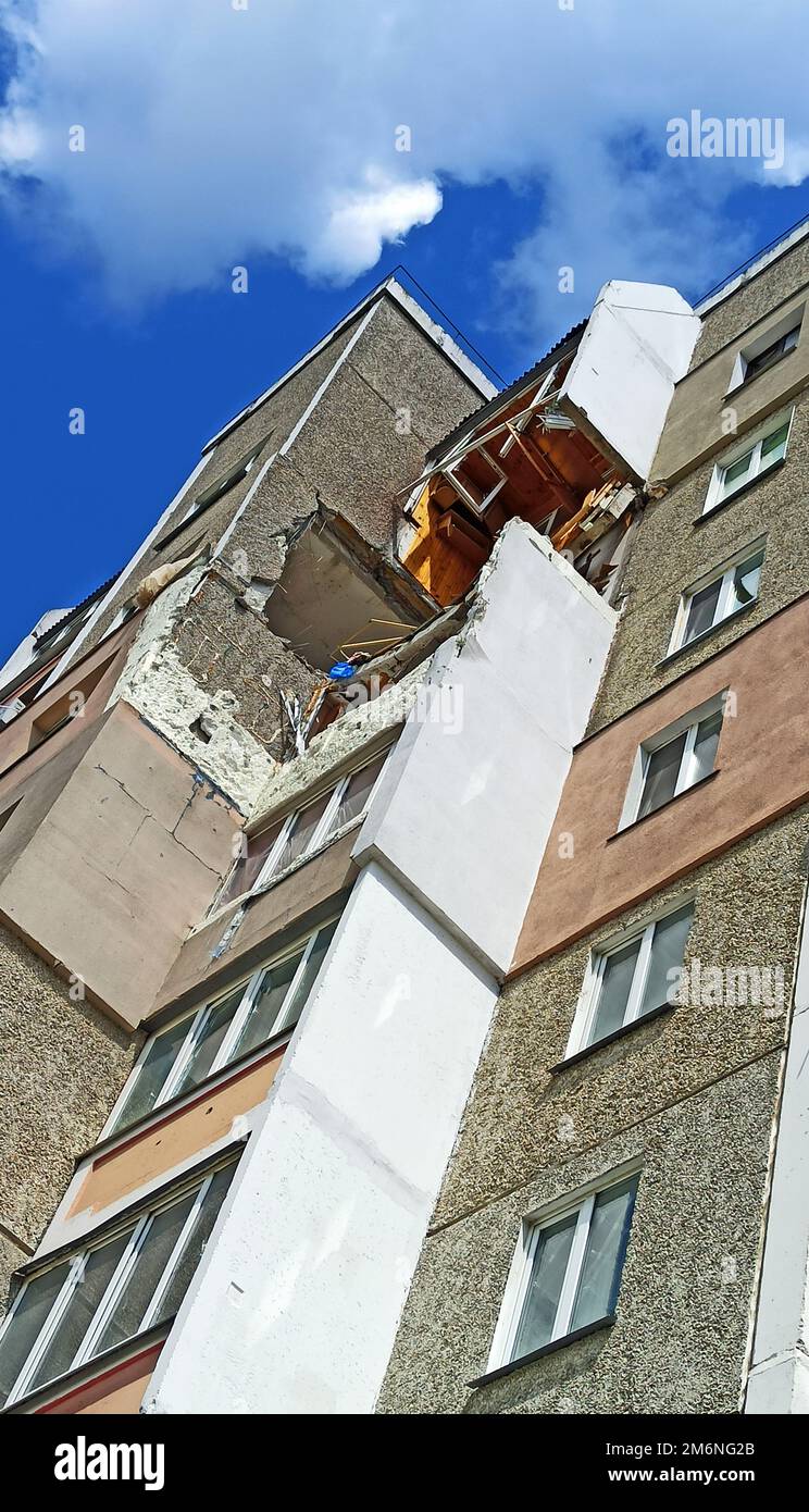 Destruction in wall of a multi-storey building after being hit by ...