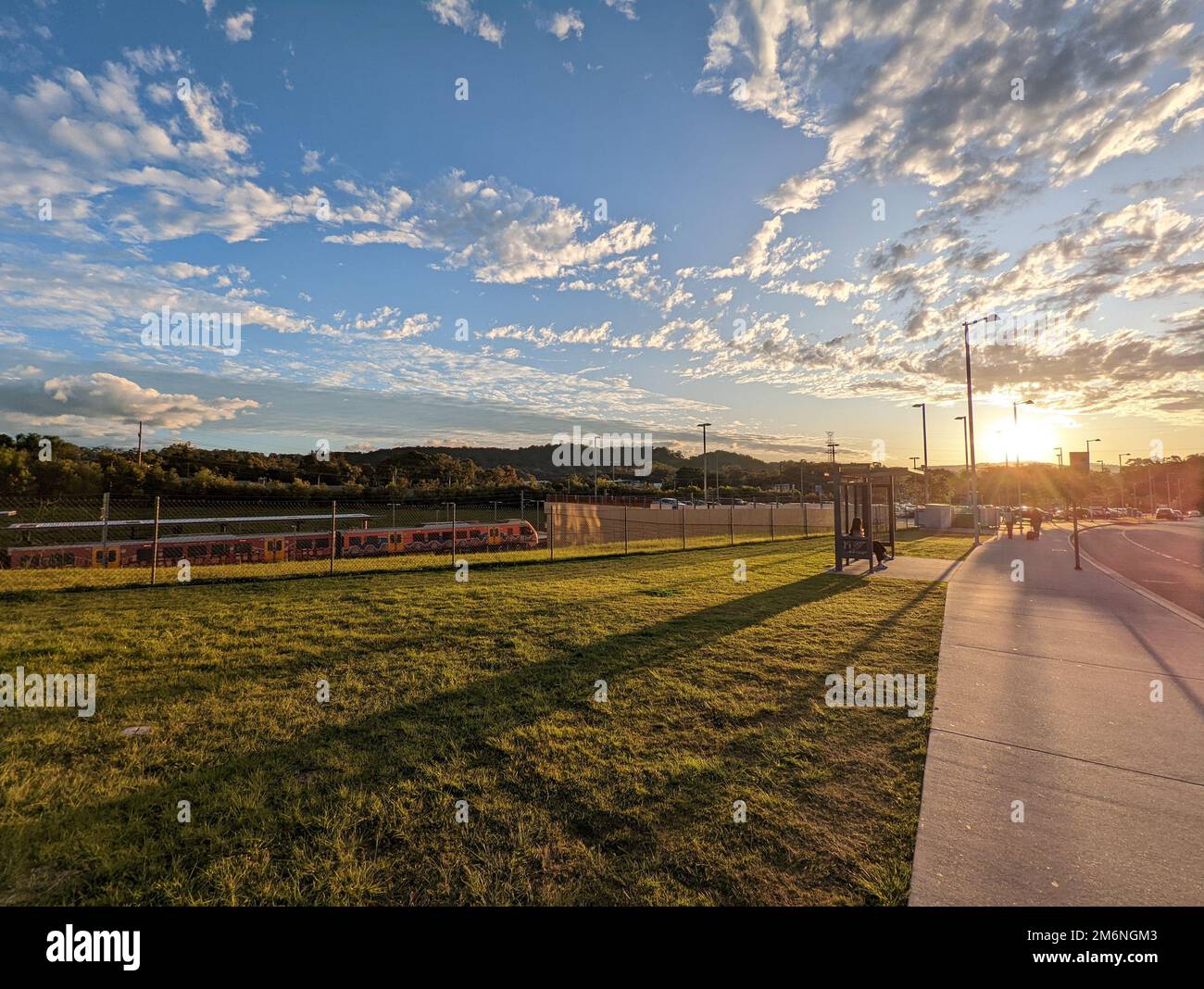 Beautiful golden hour sunset at Varsity Lakes Train station Stock Photo Alamy