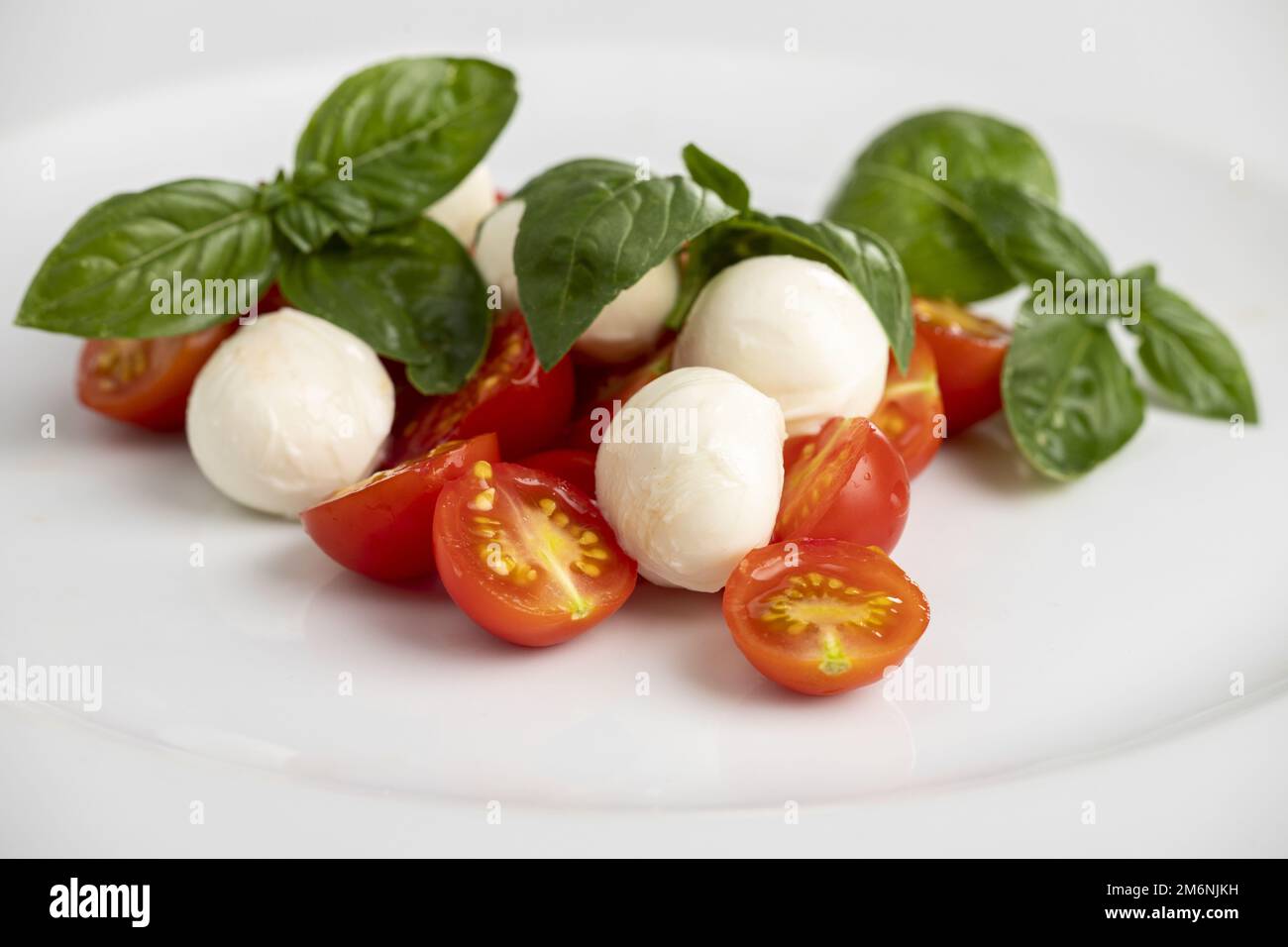 Italian insalada caprese on a white plate Stock Photo
