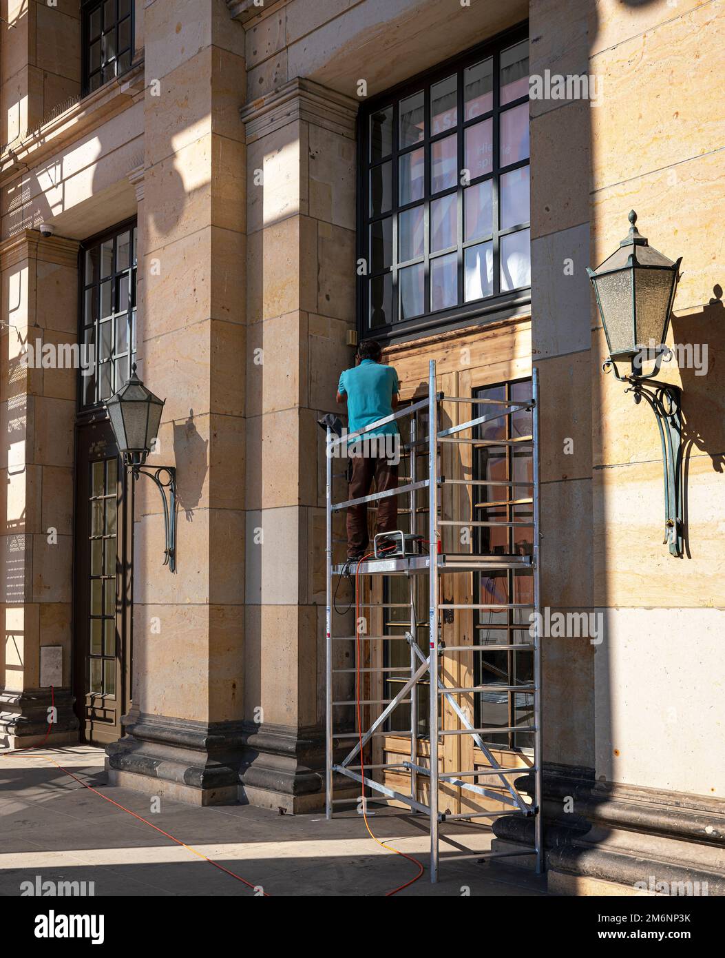 Craftsman With Small Wooden Ladder, Berlin, Germany Stock Photo