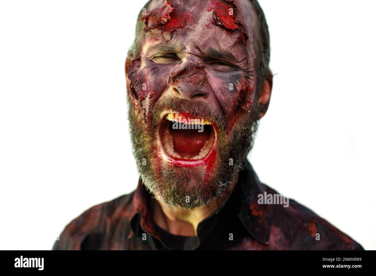 Zombie male makeup for halloween concept. Blood on skin face Stock Photo