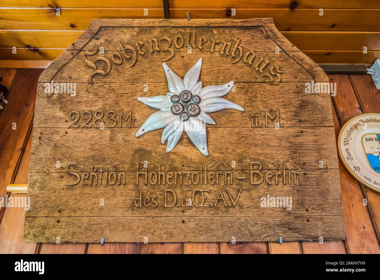 General image of the original wooden hut plaque sign at the German Alpine Club DAV Sektion Berlin owned Hohenzollern Haus mountain refuge high above the Redurschertal valley and Radurscheralm  near the village of Pfunds in the Oetztal Alps of the Austrian Tirol Stock Photo