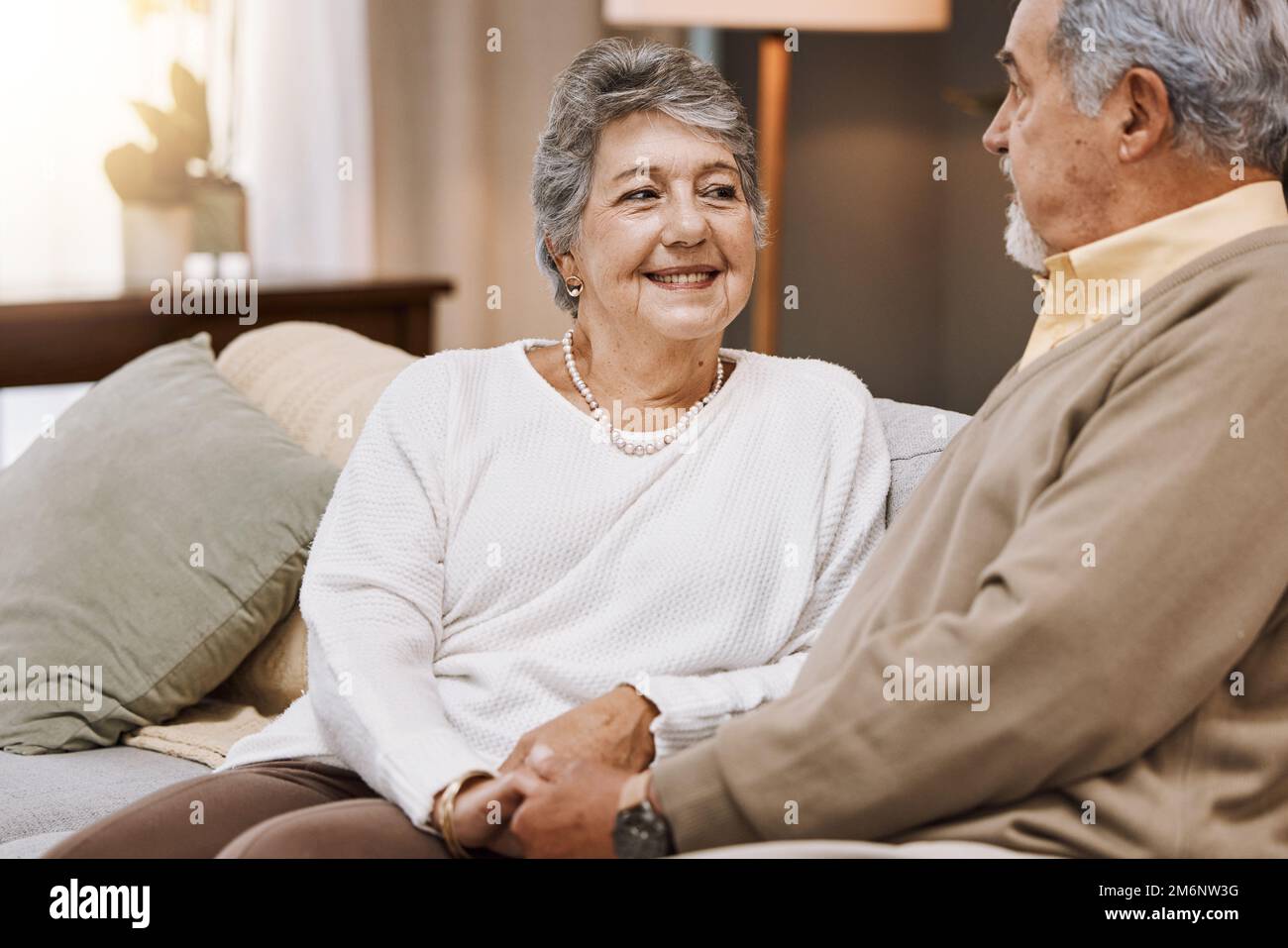 Elderly, couple and marriage with commitment and retirement, spending quality time with love and care at family home. Relationship, holding hands with Stock Photo