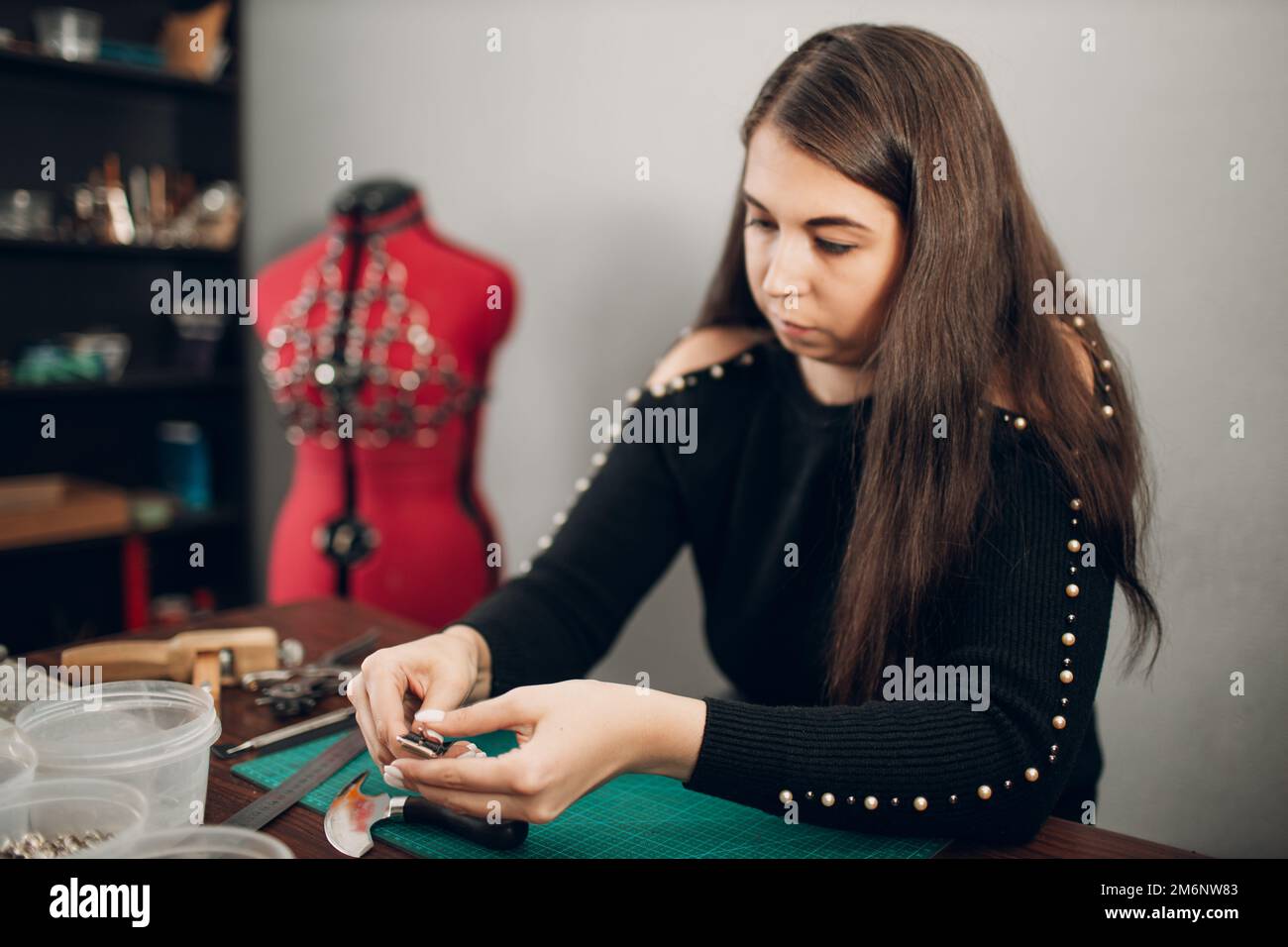 Tanner woman making leather goods on Working process of