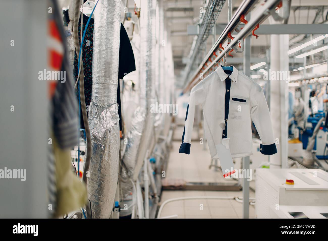 Dry cleaning clothes. Clean cloth chemical process. Laundry industrial dry-cleaning Stock Photo