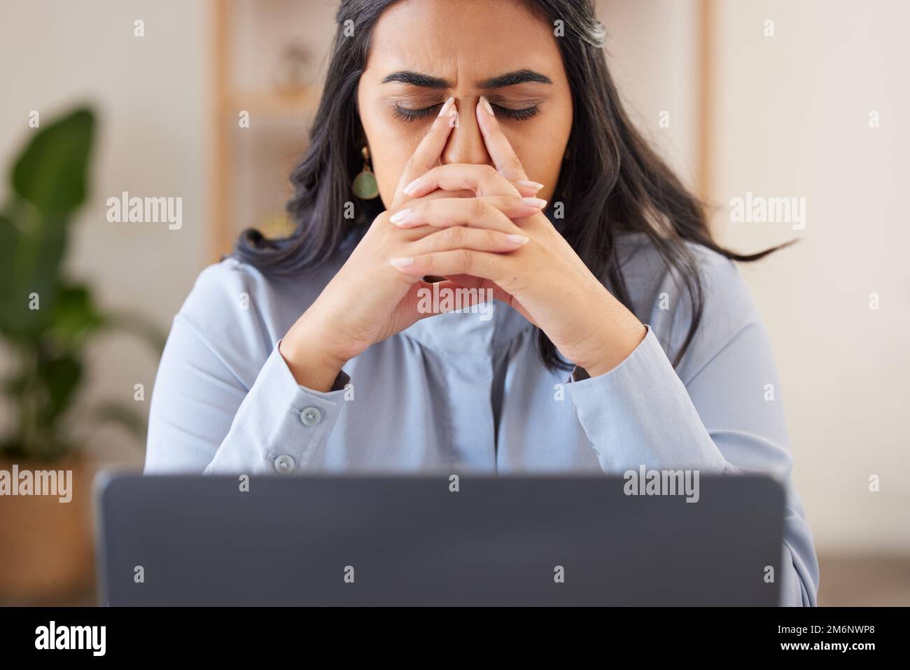 Corporate woman, laptop and headache with stress, anxiety and tired at desk in web design workplace. Executive leader, manager and burnout with Stock Photo