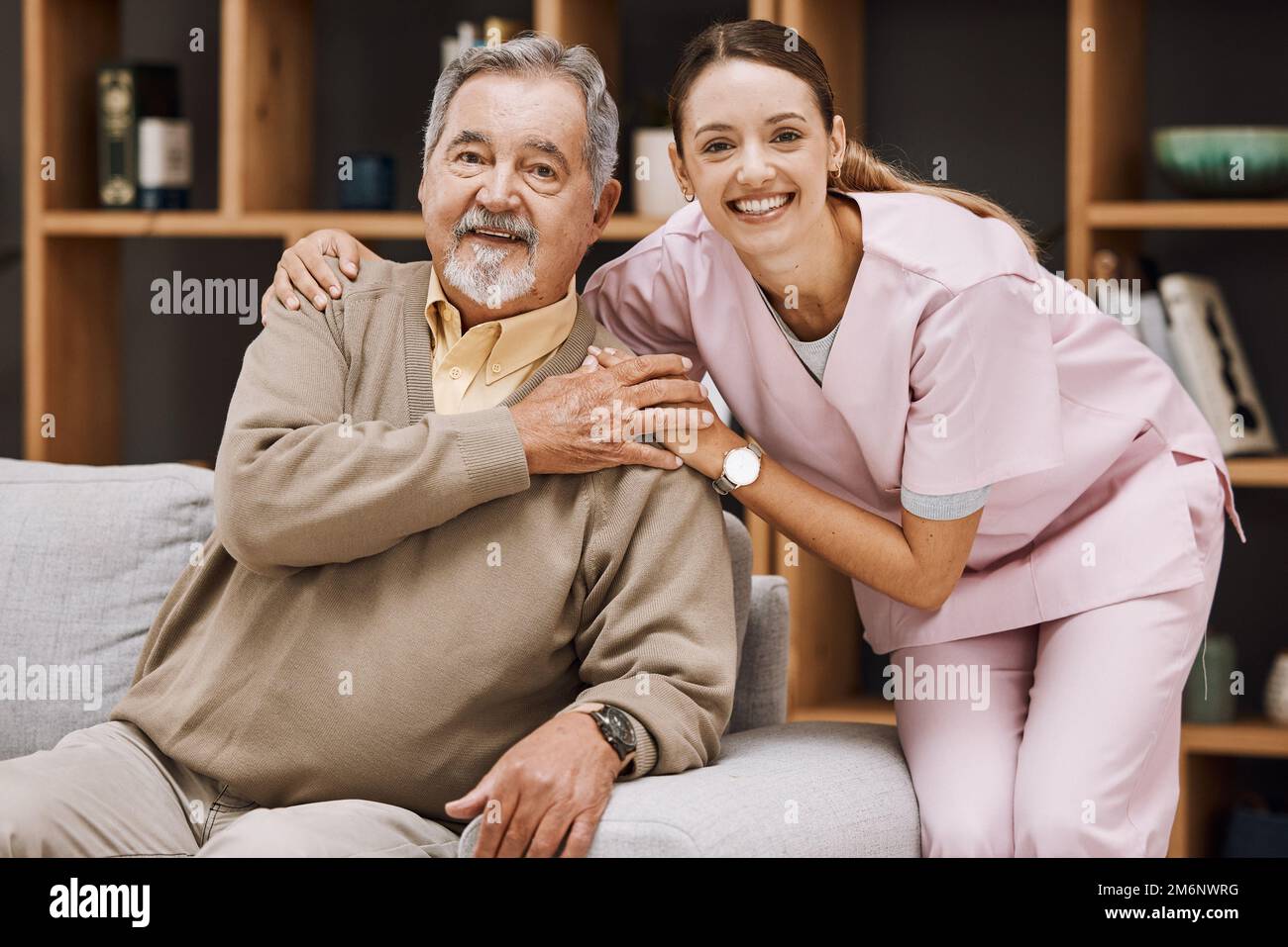 Healthcare, support and doctor with a senior man for medical attention, consulting and nursing from a house. Trust, hug and portrait of a caregiver Stock Photo
