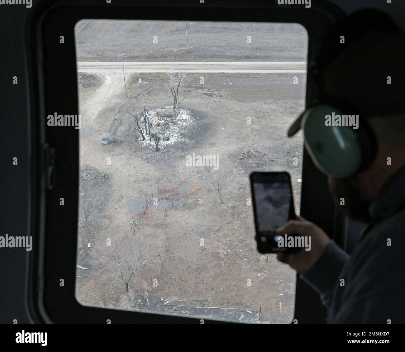 Fire Chief Justin Mowry of the Wilsonville, Nebraska, Volunteer Fire Department views wildfire