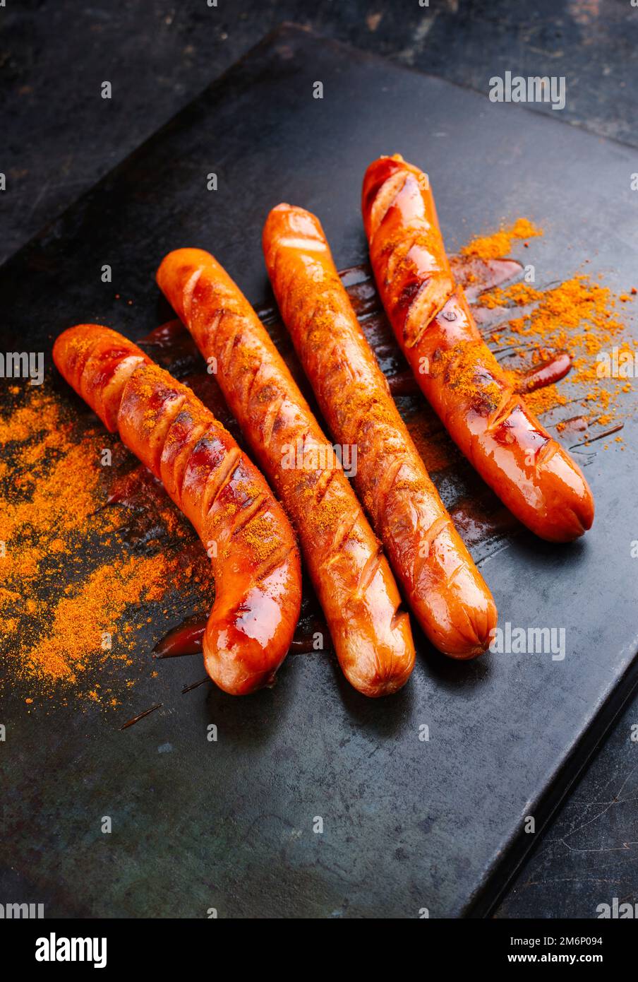Traditional German barbecue curry wurst sausages with ketchup and curry