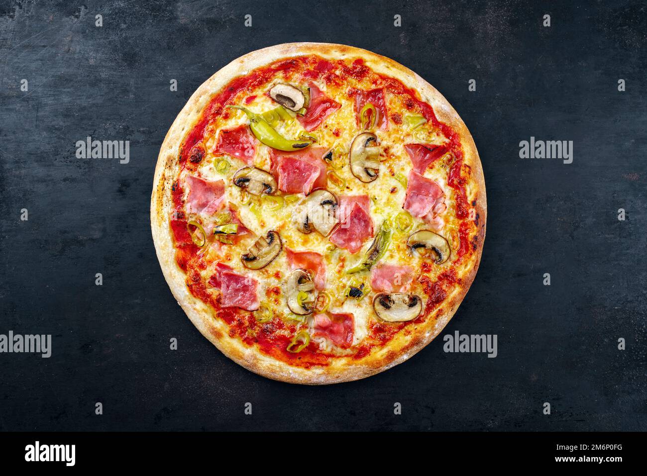 Traditional Italian pizza prosciutto e funghi with ham Stock Photo Alamy