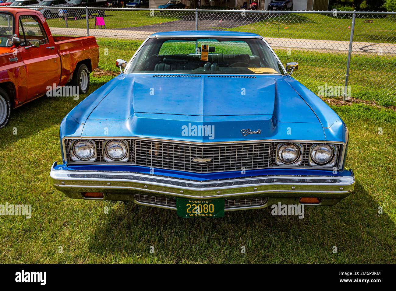 Iola, WI - July 07, 2022: High perspective front view of a 1973 Chevrolet Impala 2 Door Hardtop at a local car show. Stock Photo