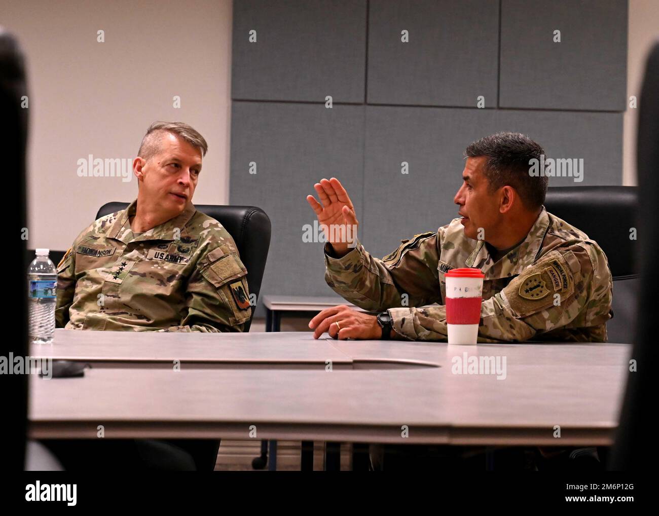 From left, Gen. Daniel Hokanson, chief, National Guard Bureau, meets with New Hampshire Adjutant Gen. David Mikolaities and other senior New Hampshire Army and Air National Guard leaders during a visit to Pease Air National Guard Base in Newington, New Hampshire, on May 3, 2022. Hokanson and his team also convened with adjutants general from 11 states during the visit to discuss strategic initiatives and conduct an information-sharing forum. Stock Photo