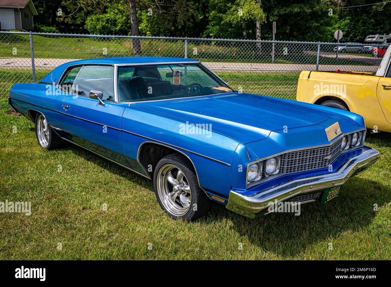 Iola, WI - July 07, 2022: High perspective front corner view of a 1973 Chevrolet Impala 2 Door Hardtop at a local car show. Stock Photo