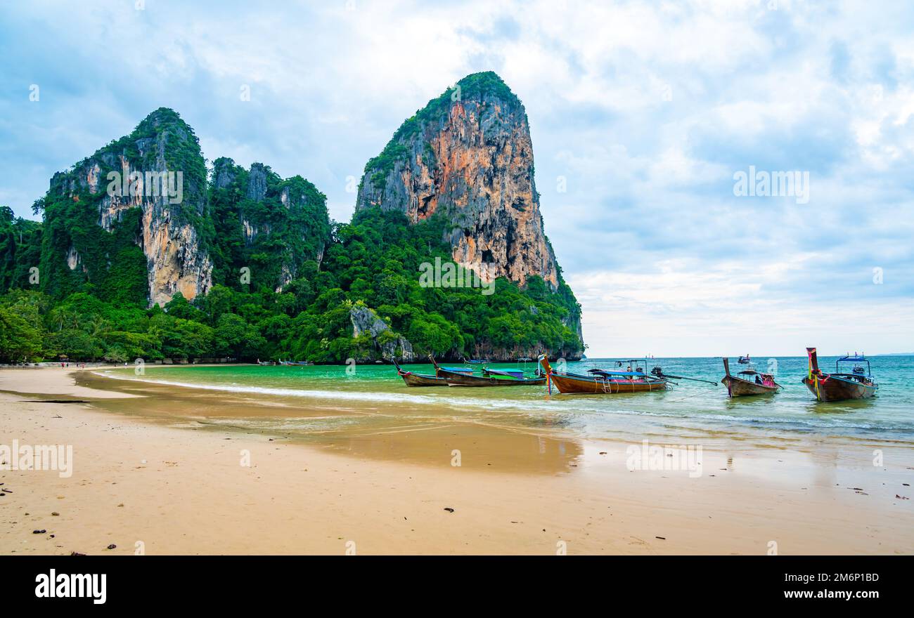 Long tail boats at Railay beach, Krabi, Thailand. Tropical paradise, turquoise water and white sand. Stock Photo
