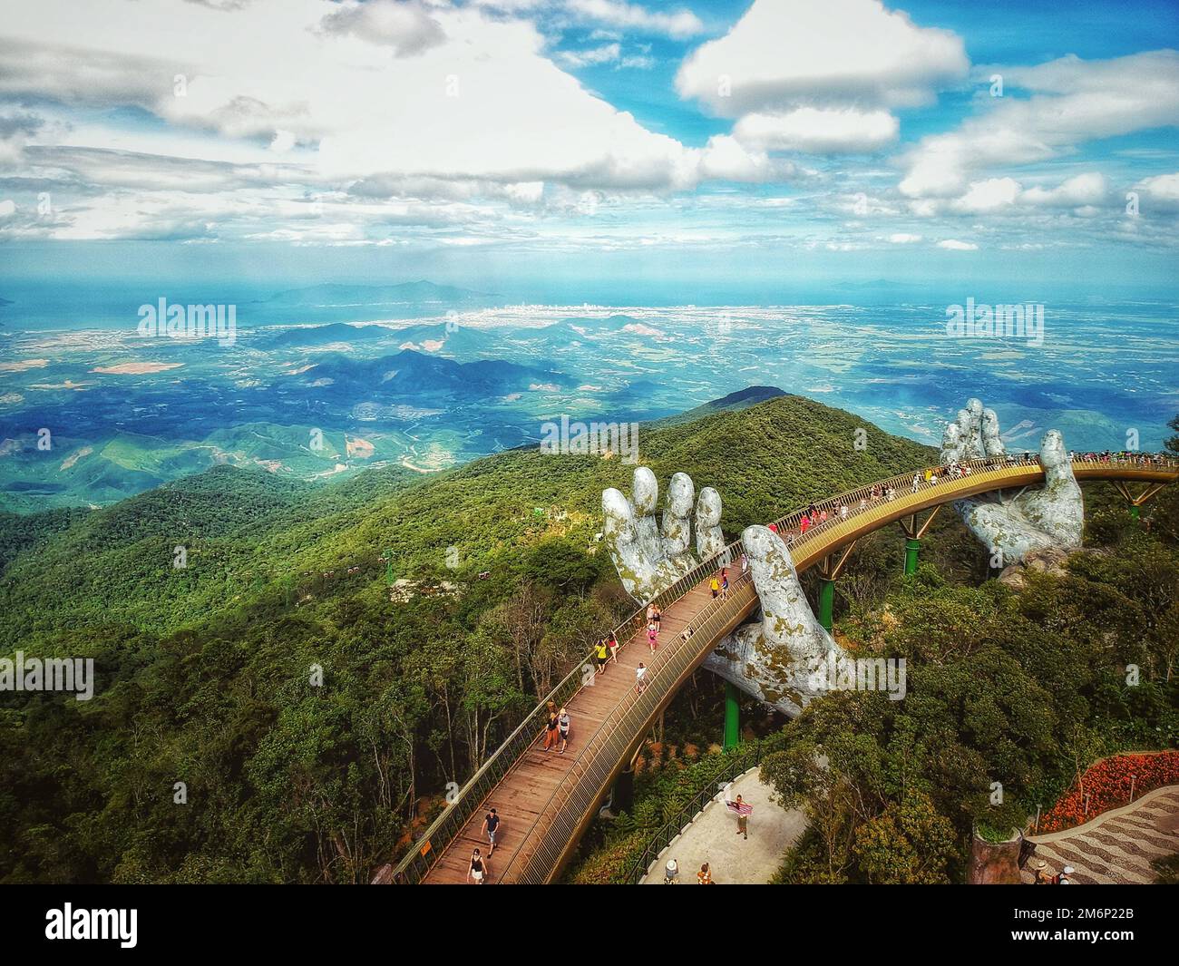 A High Angle Shot Of A Golden Bridge Ba Na Hills Da Nang Vietnam a-high-angle-shot-of-a-golden-bridge-ba-na-hills-da-nang-vietnam