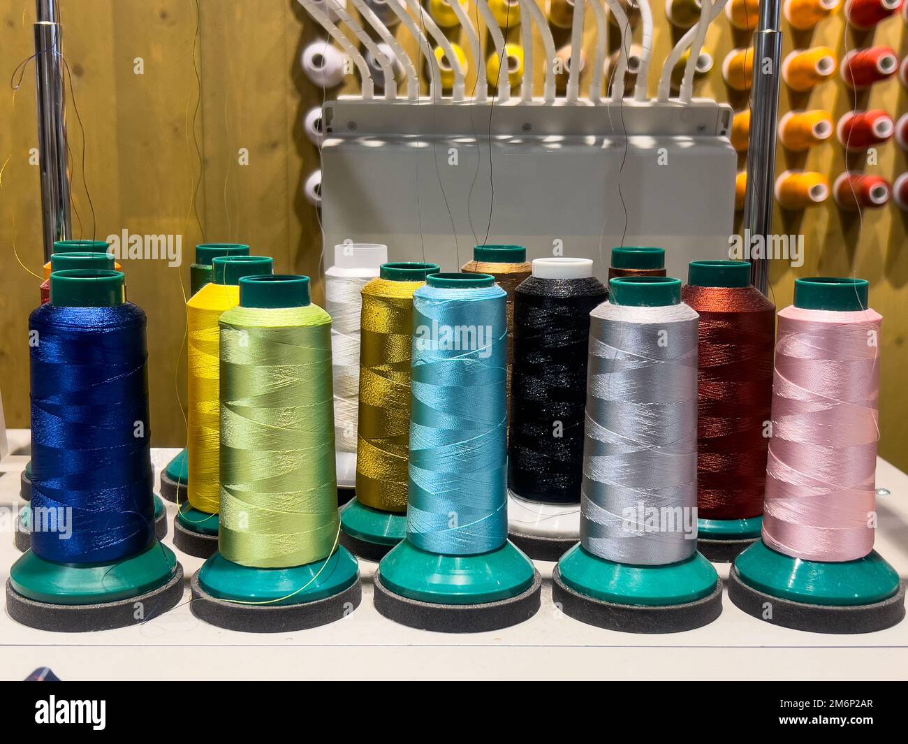 Sewing colourful threads display inside a Muji retail store. Stock Photo