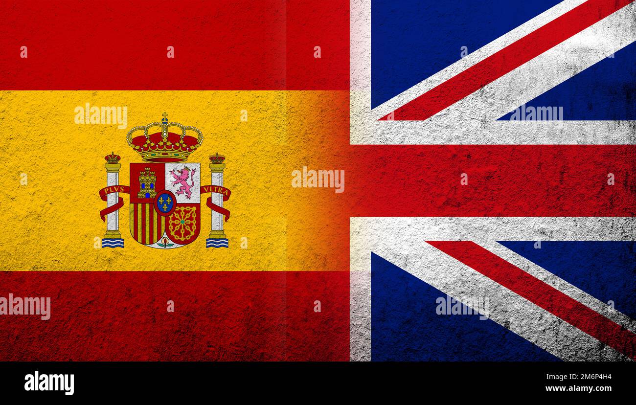National flag of United Kingdom (Great Britain) Union Jack with Kingdom of Spain National flag. Grunge background Stock Photo