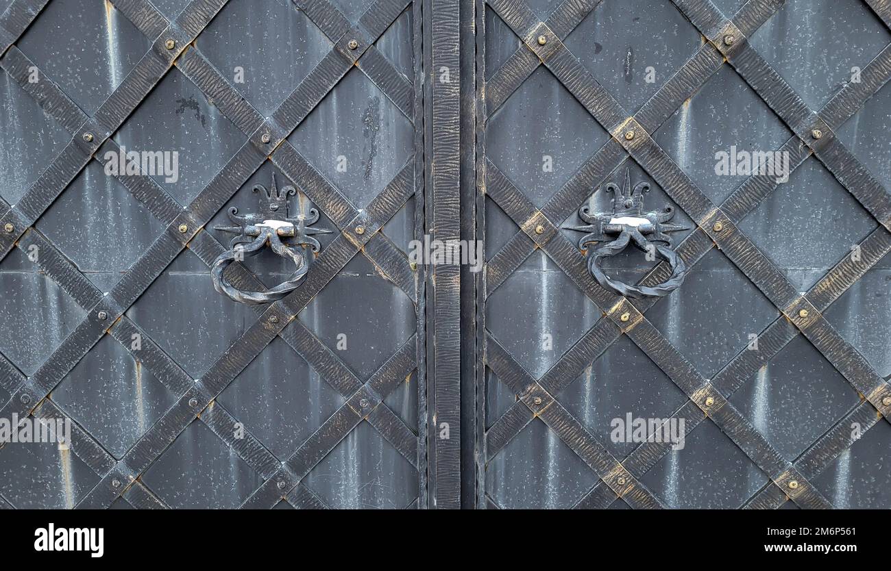 Wrought iron gates with round handles Stock Photo Alamy