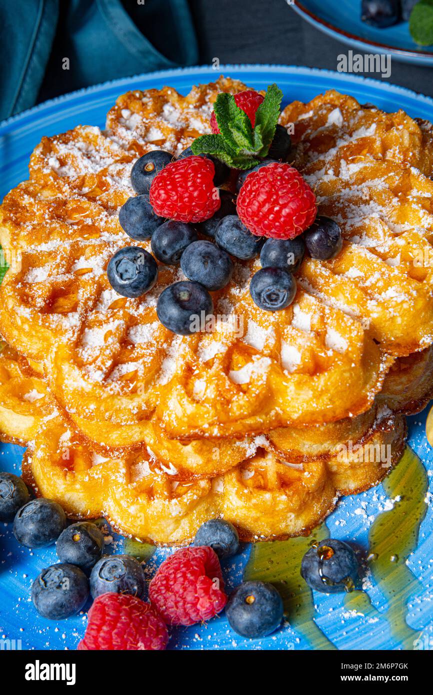 Simple sweet waffles with raspberries and blueberries Stock Photo