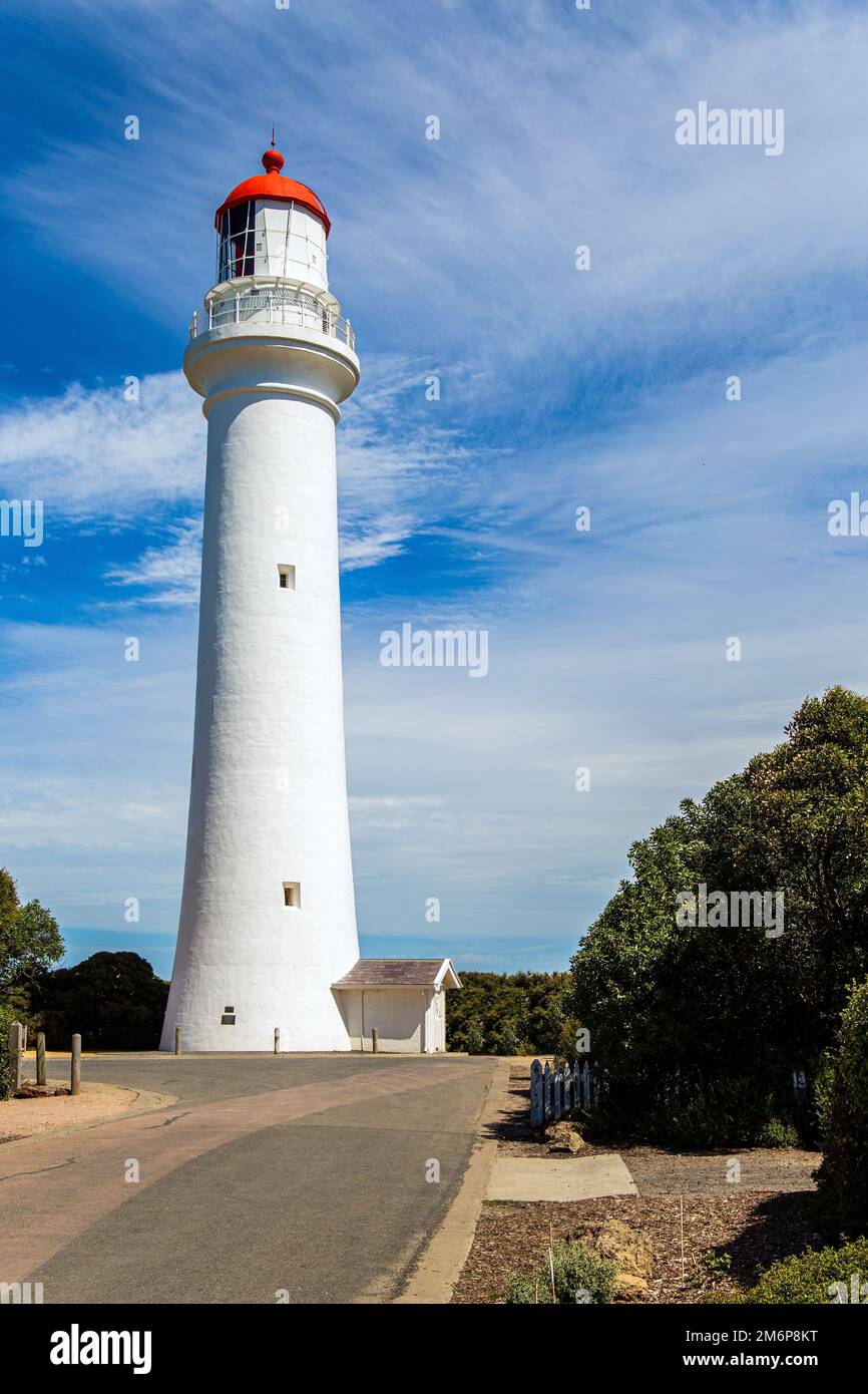 Lighthouse on the ocean shore Stock Photo